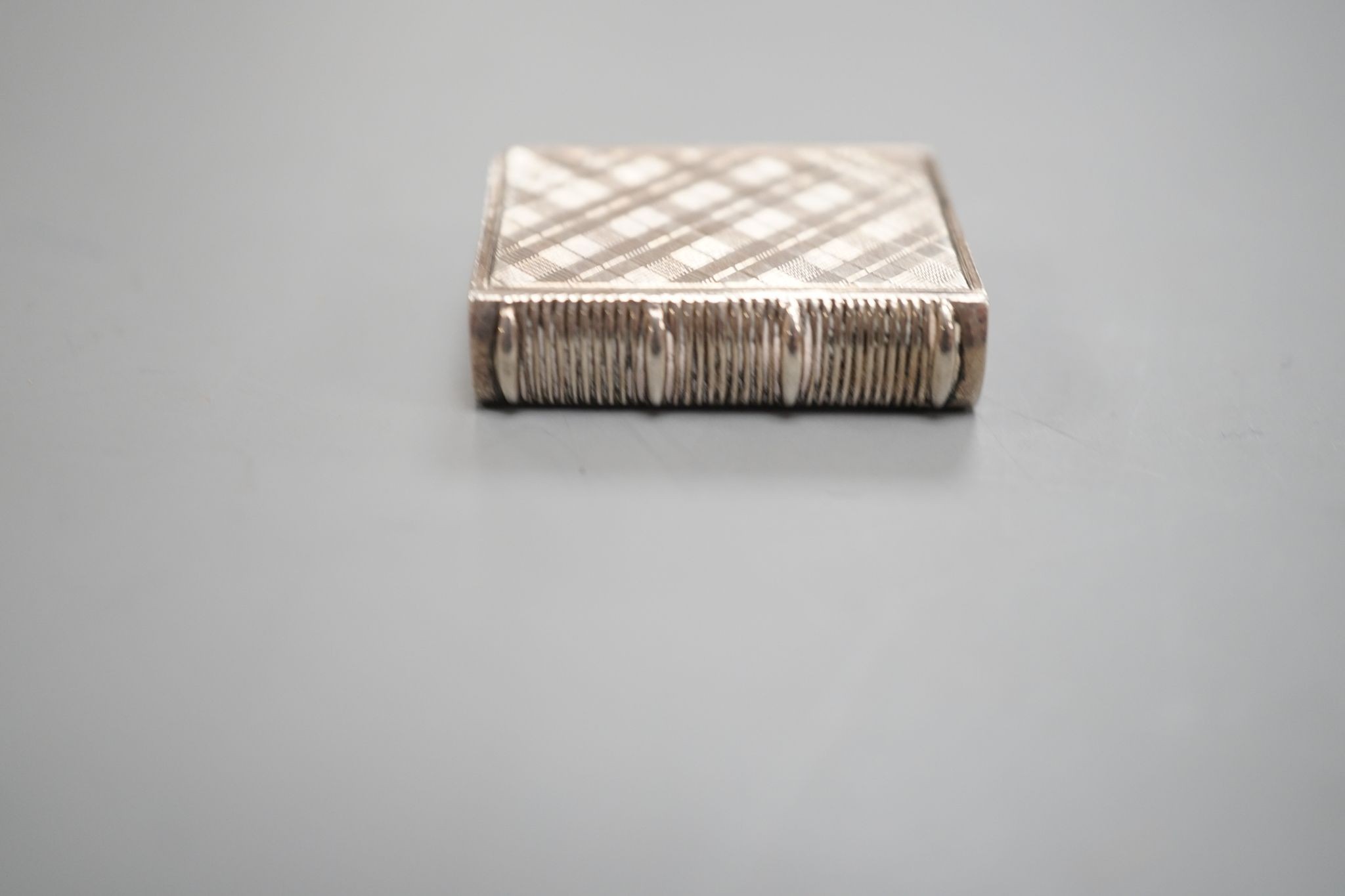 An early Victorian novelty silver vinaigrette, modelled as a book, Taylor & Perry, Birmingham, 1838, 26mm.